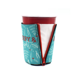 Blue ZipSip with Christmas foliage with Merry and bright on a solo cup